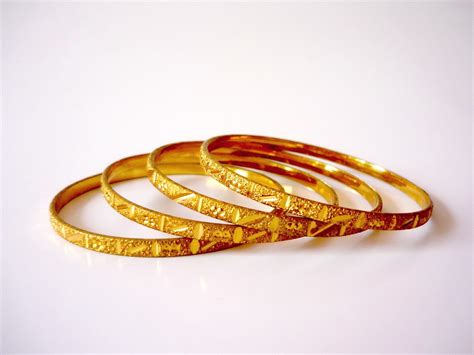 Discover the Intriguing History and Cultural Significance of Luxurious Golden Bangles