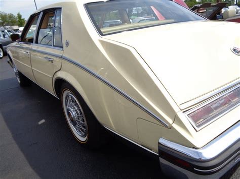 Driving in Style: The Elegance and Prestige of Owning a Ivory Cadillac