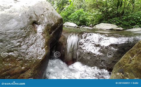 Escaping Reality: Exploring the Allure of a Enchanting Cascading Stream
