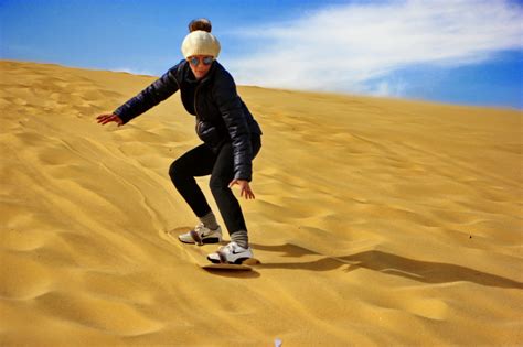 Experience the Excitement of Sandboarding on Breathtaking Dunes