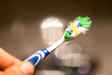 How Does the Accumulation of Dirt on a Toothbrush Occur?