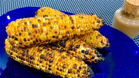 Indulging in the Joy of Devouring a Roasted Corn on the Cob