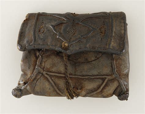 The Historical Significance of the Worn Pouch: Tracing its Origins