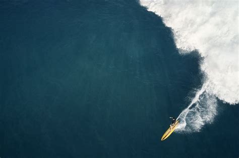 The Thrill of Conquering Gigantic Swells: A Surfer's Ultimate Aspiration