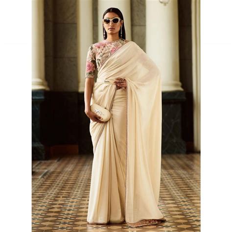 Unveiling the Profound Meanings of the Ivory Saree: Exploring its Symbolic Significance